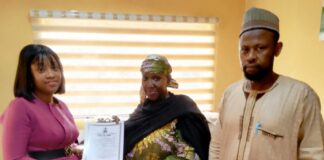 Ag. Executive Director, NIWRMC, Hajiya Sakinatu Abbo Jimeta(M) presenting the Water Use Licence to Pamela Gold, the Senior Manager, Legal and Regulatory, Penstock Energy Ltd (L), flanked by the Director, Allocation and Authorization, Engr. Shazali Uba Ajingi (R) in NIWRMC, Abuja